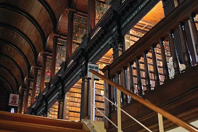 Long Room library interior with tiered bookshelves and gallery