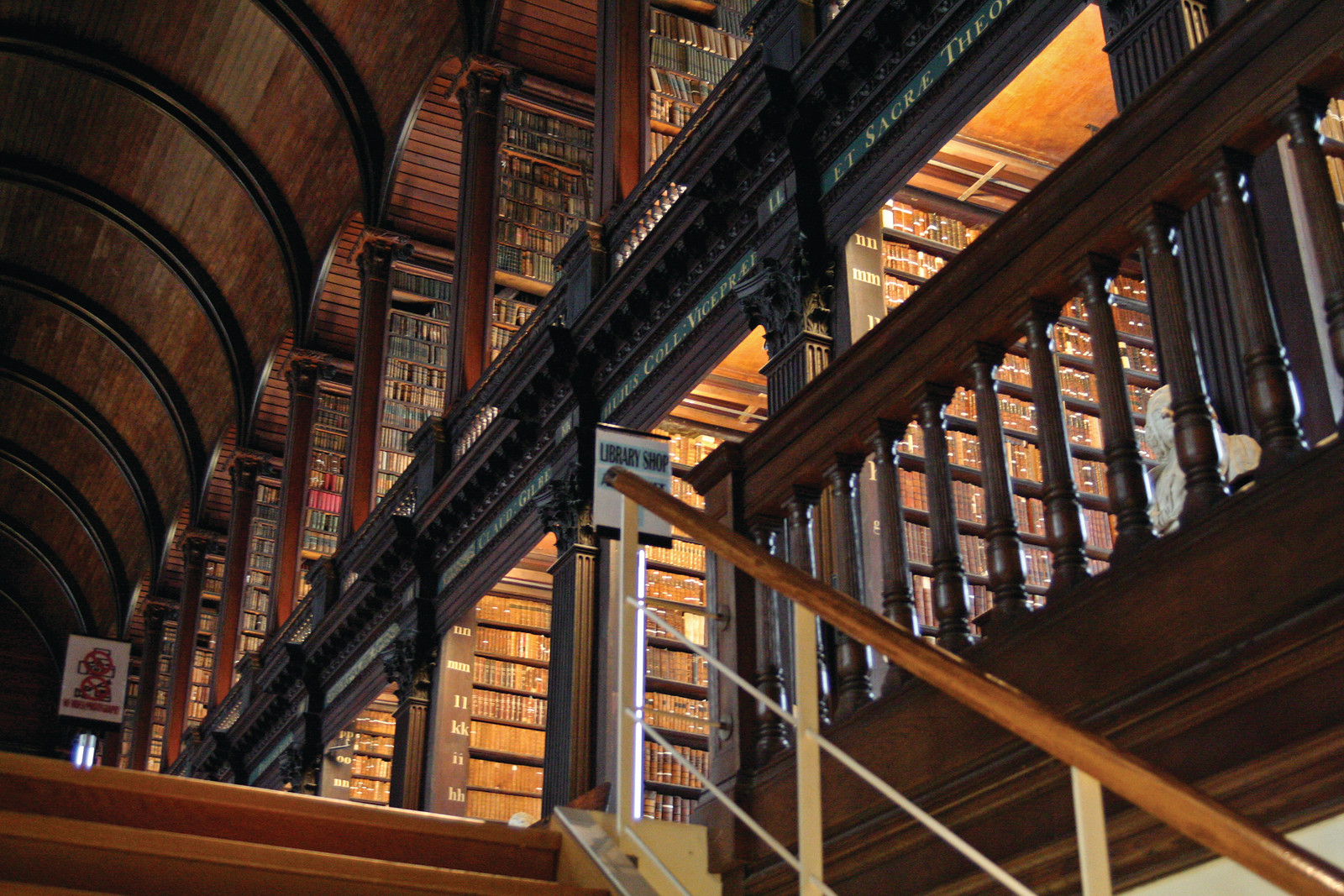 Long Room library interior with tiered bookshelves and gallery — historic image