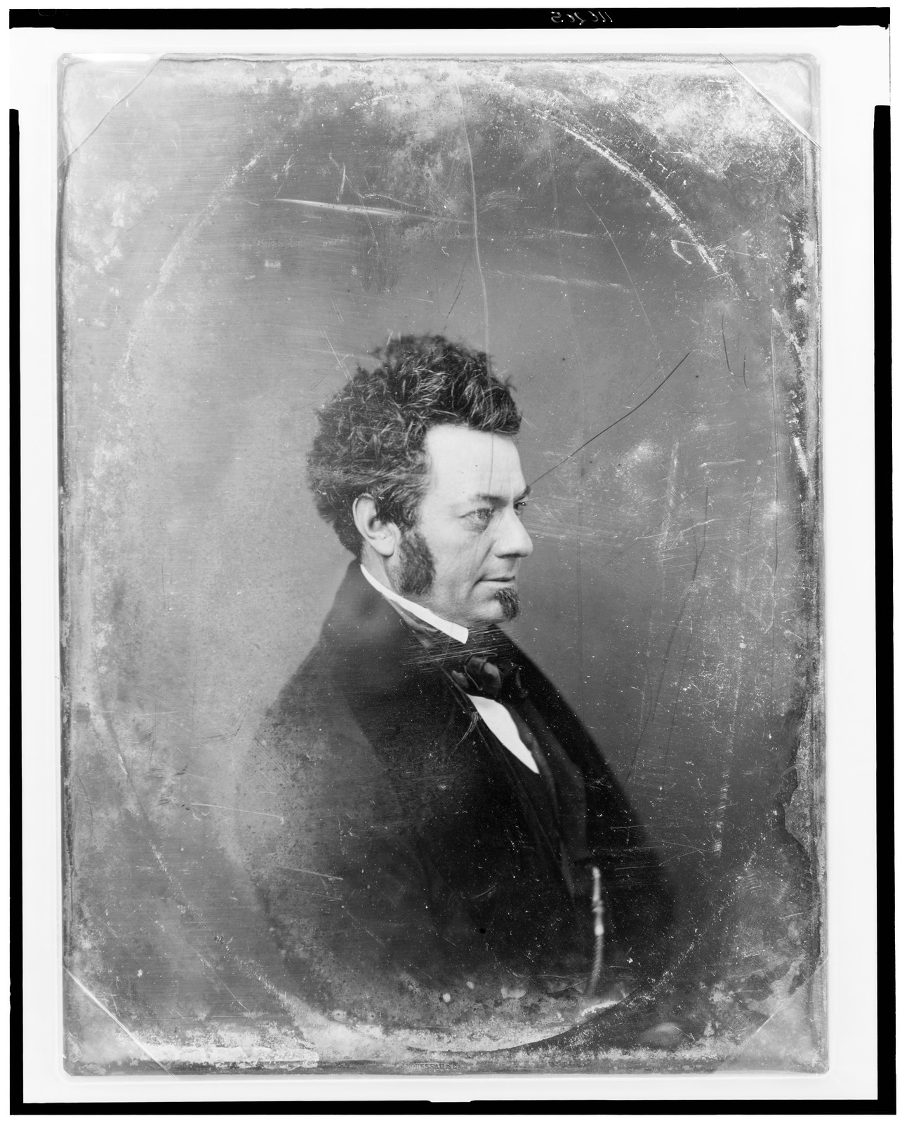 Daguerreotype head and shoulders portrait of a man in profile, 1844 — historic photograph