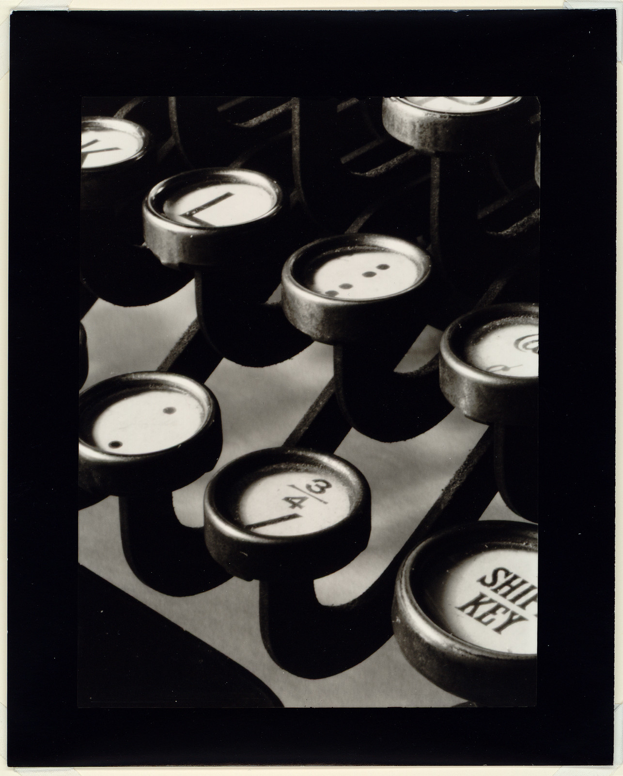 Close-up photograph of typewriter keys, including a SHIFT KEY — historic photograph