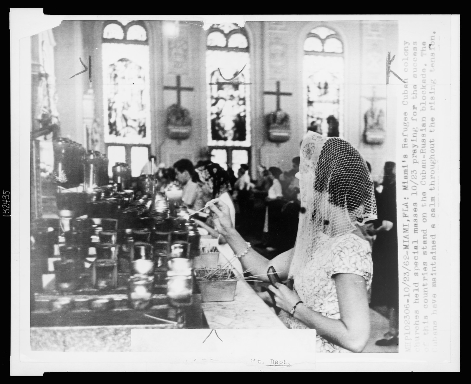 Miami's refugee Cuban colony churches held special masses 10/23 praying for the success of this countries (sic) stand on the Cuban-Russian blockade ..., 1962 Oct. 23. — historic photograph