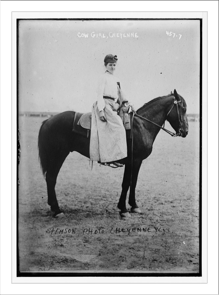 Cow-girl, mounted on horse. Photo by Stimson, Cheyenne, Wyoming Cheyenne, Stimson / Stimson, n/a — historic photograph