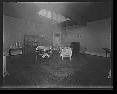 [Room with medicine cabinet, basins, and massage or treatment table, probably the Ypsilanti mine bath house, Ypsilanti, Mich.]