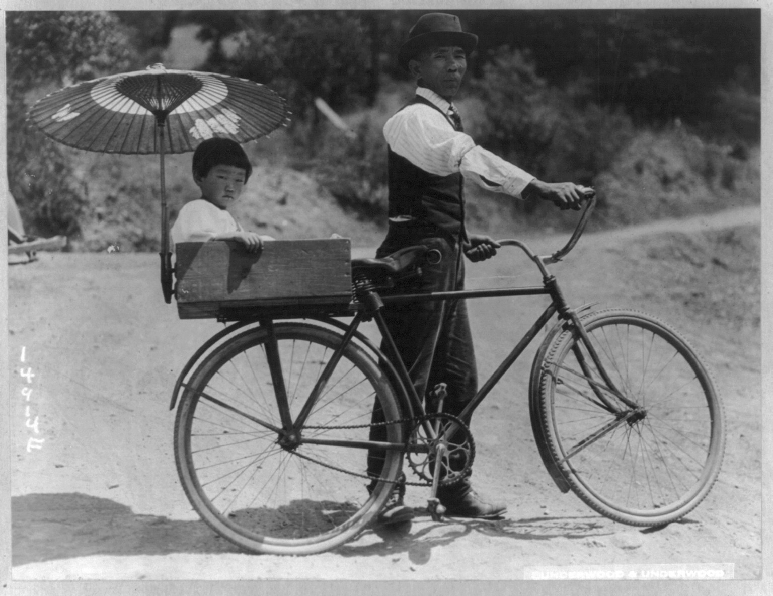 [Japanese man with a bicycle with a child in a box on the back, in Preston, Calif.] — historic photograph