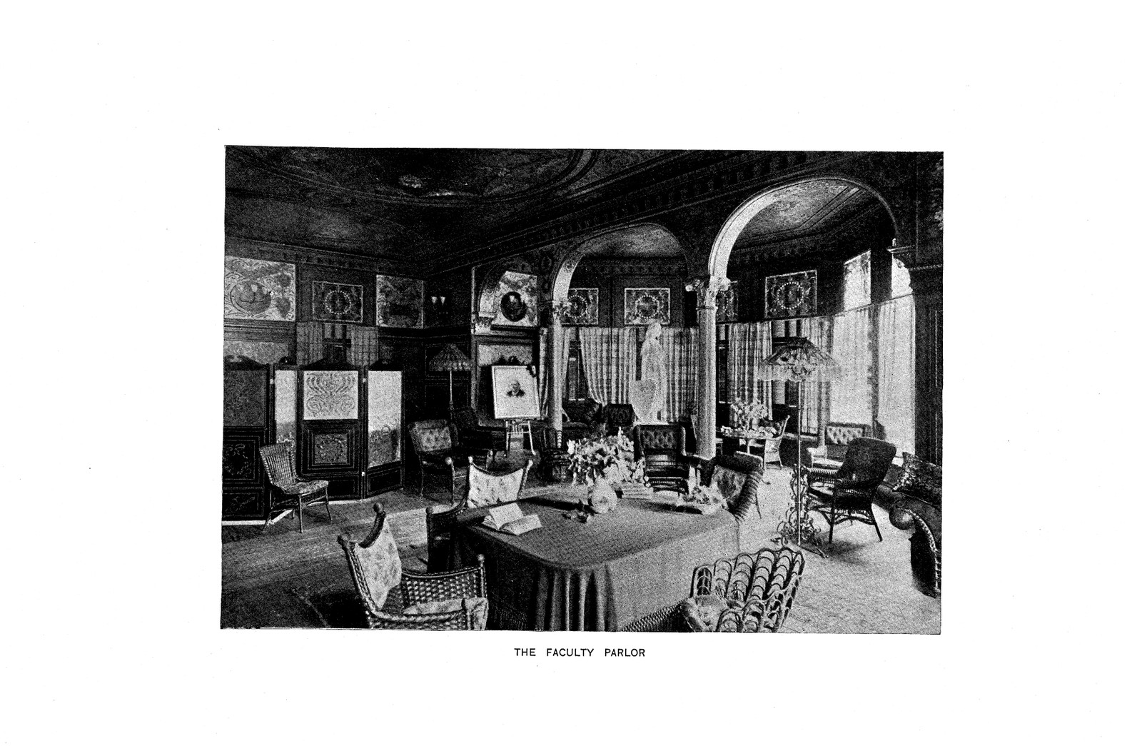 The Faculty Parlor, interior with arches and wicker chairs — antique map