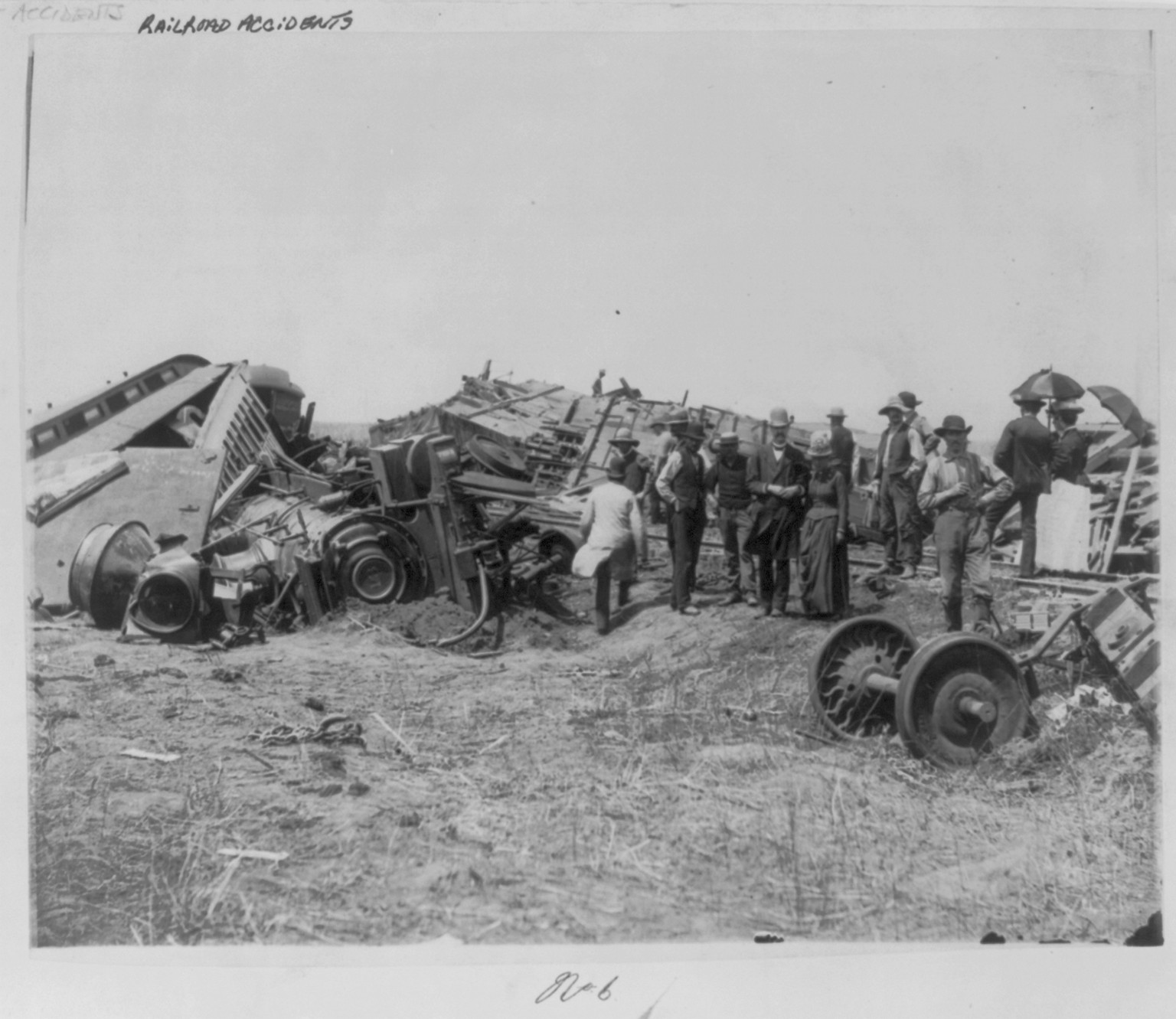 View of the great railroad wreck [on the T., P. & W.R.R. near Chatsworth, Illinois, of the Niagara Excursion Train, August 10th, 1887. From south side looking northwest, showing the complete destruction of engine No. 13, and the point Engineer McClintock was taken from], 1887 — historic photograph