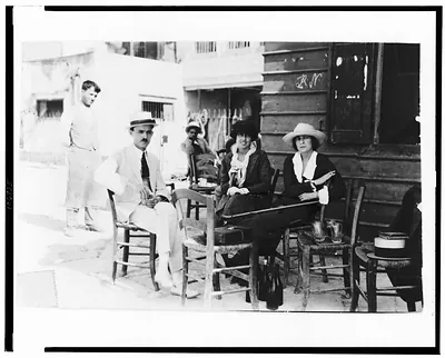 [Solita Solano, Janet Flanner, and a man seated outdoors, Crete]