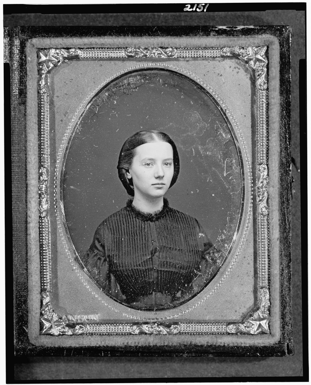Portrait of a young woman in a daguerreotype case, 1862 — historic photograph