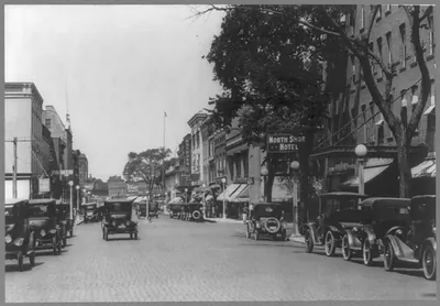 [Ill. - Evanston - street scene; many autos parked]