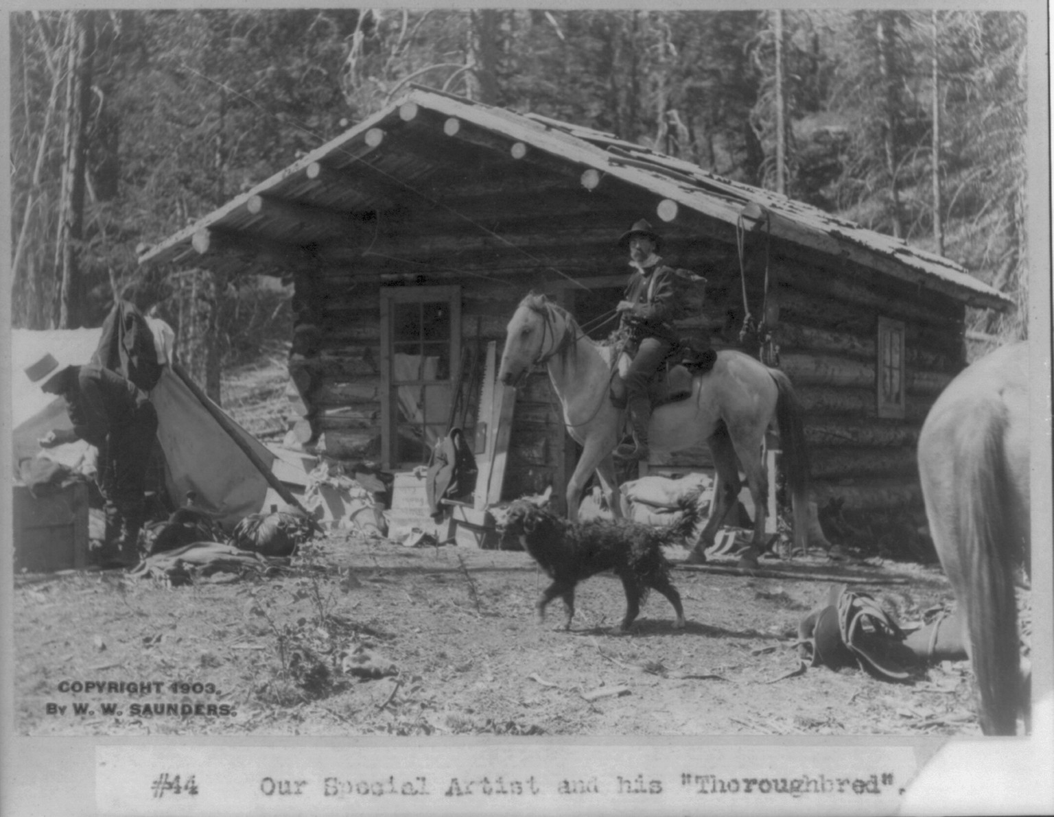 [Idaho - Roosevelt: our special artist and his 'thoroughbred'" (man on horseback in front of log cabin)]", c1903. — historic photograph