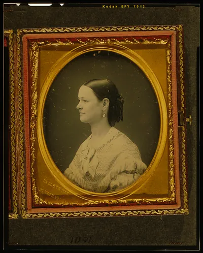 [Unidentified woman, head-and-shoulders portrait, facing left]