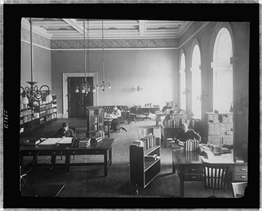 [Five people working in a reading room(?) of the Library of Congress], [between 1897 and 1926] — historic photograph