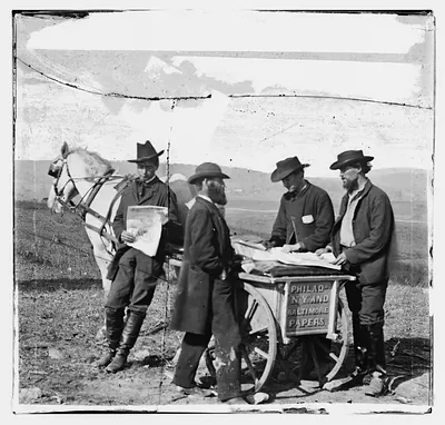 Newspaper vendor's cart with Philadelphia, New York and Baltimore papers
