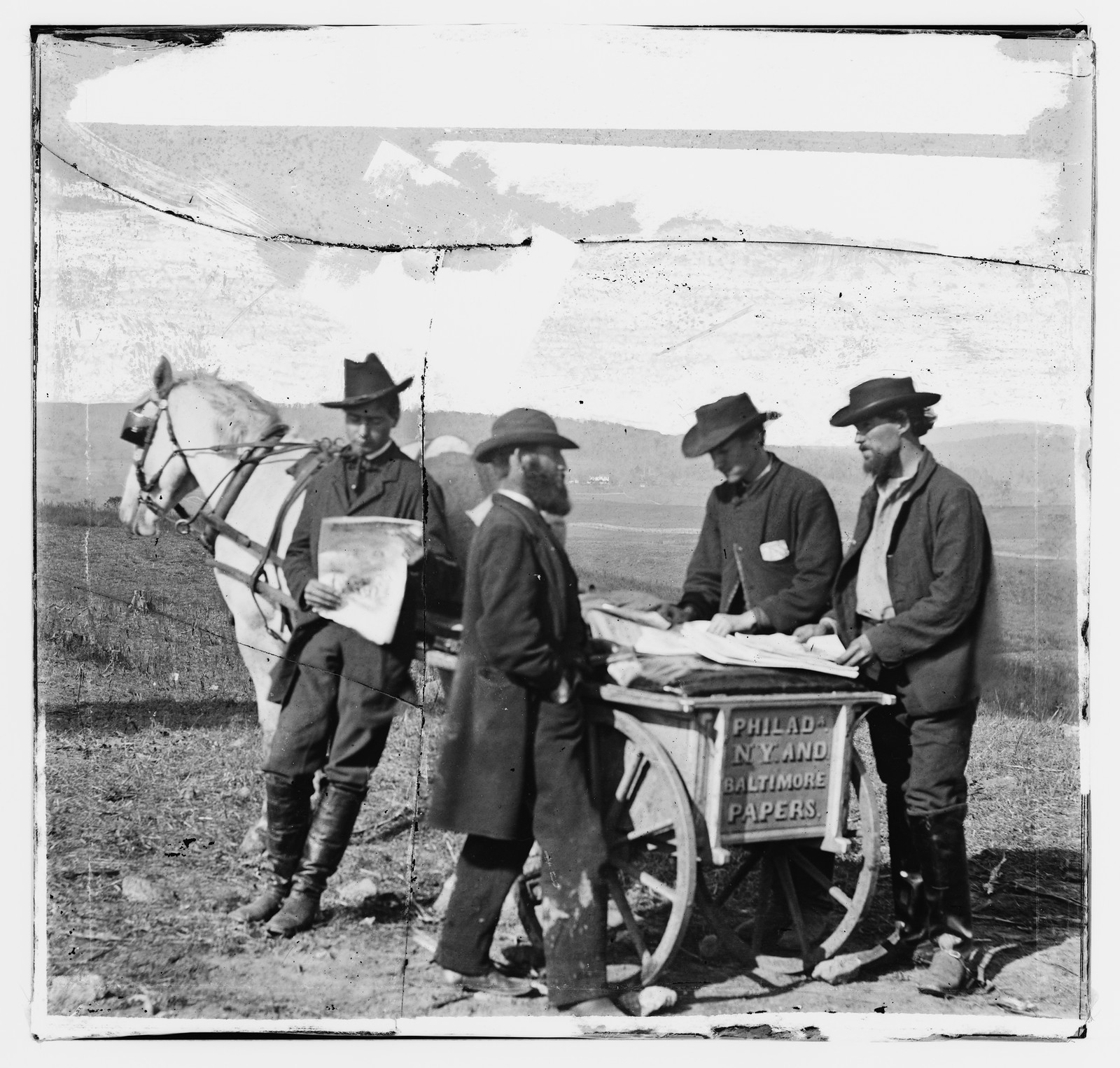 Newspaper vendor's cart with Philadelphia, New York and Baltimore papers — historic image