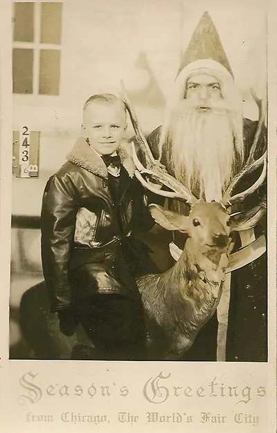 Boy with Santa Claus and reindeer, Season's Greetings postcard