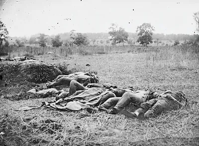 Dead soldiers lying in a field, black and white photograph