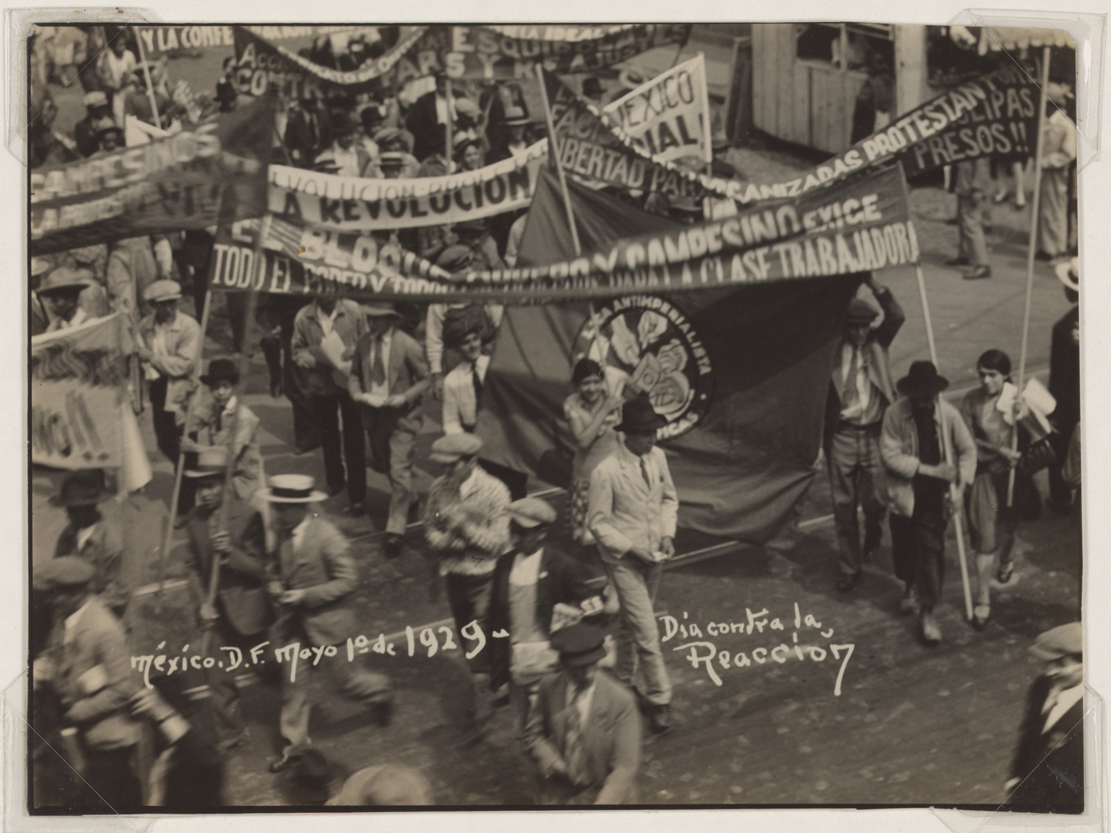 May Day 1929 march in Mexico City with protest banners — historic image