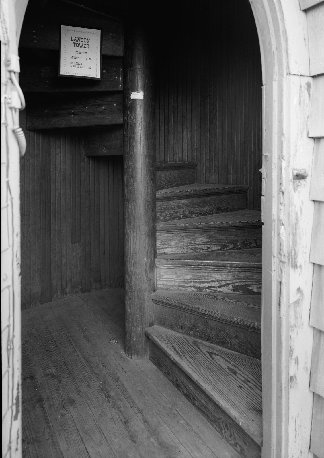 Spiral staircase inside Lawson Tower with donation sign — historic image