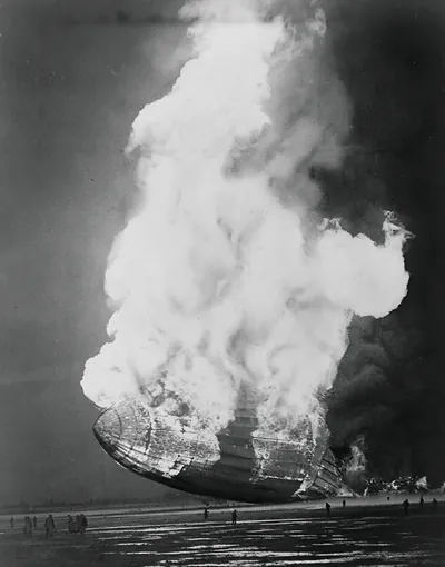 [The Hindenburg hits the ground in flames in Lakehurst, N.J.]