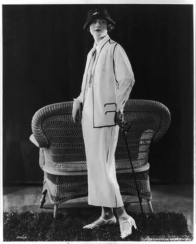 Women modeling clothing: White flannel suit from Davidow Sons