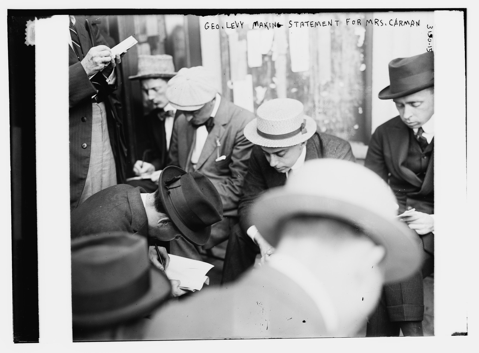 Geo. Levy making statement for Mrs. Carman, n/a — historic photograph