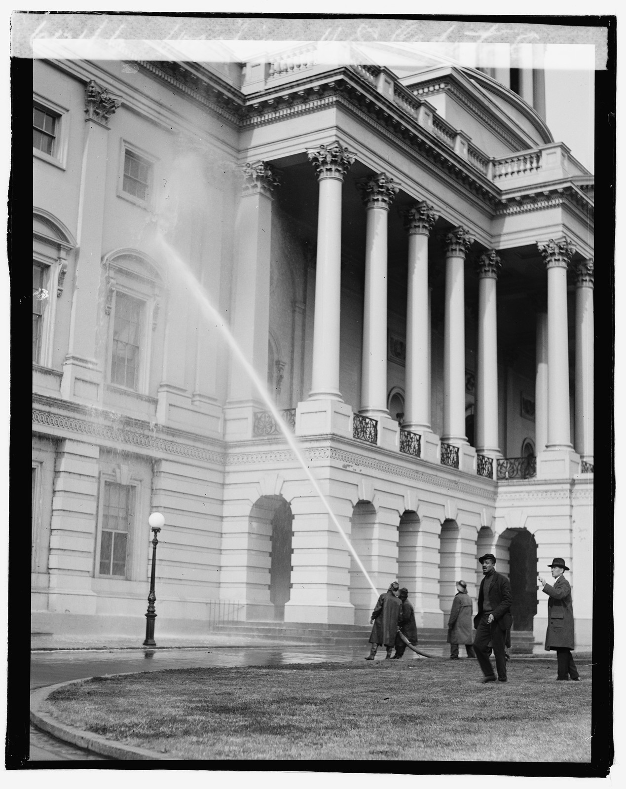 Washing U.S. Capitol, 1919 November 28. — historic photograph