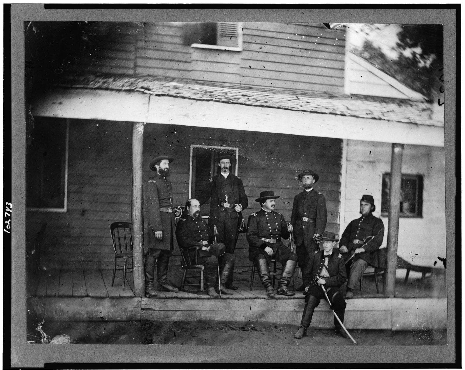 [Gen. Alexander McCook and staff posed on porch near Washington, D.C.], [between 1861 and 1865] — historic photograph