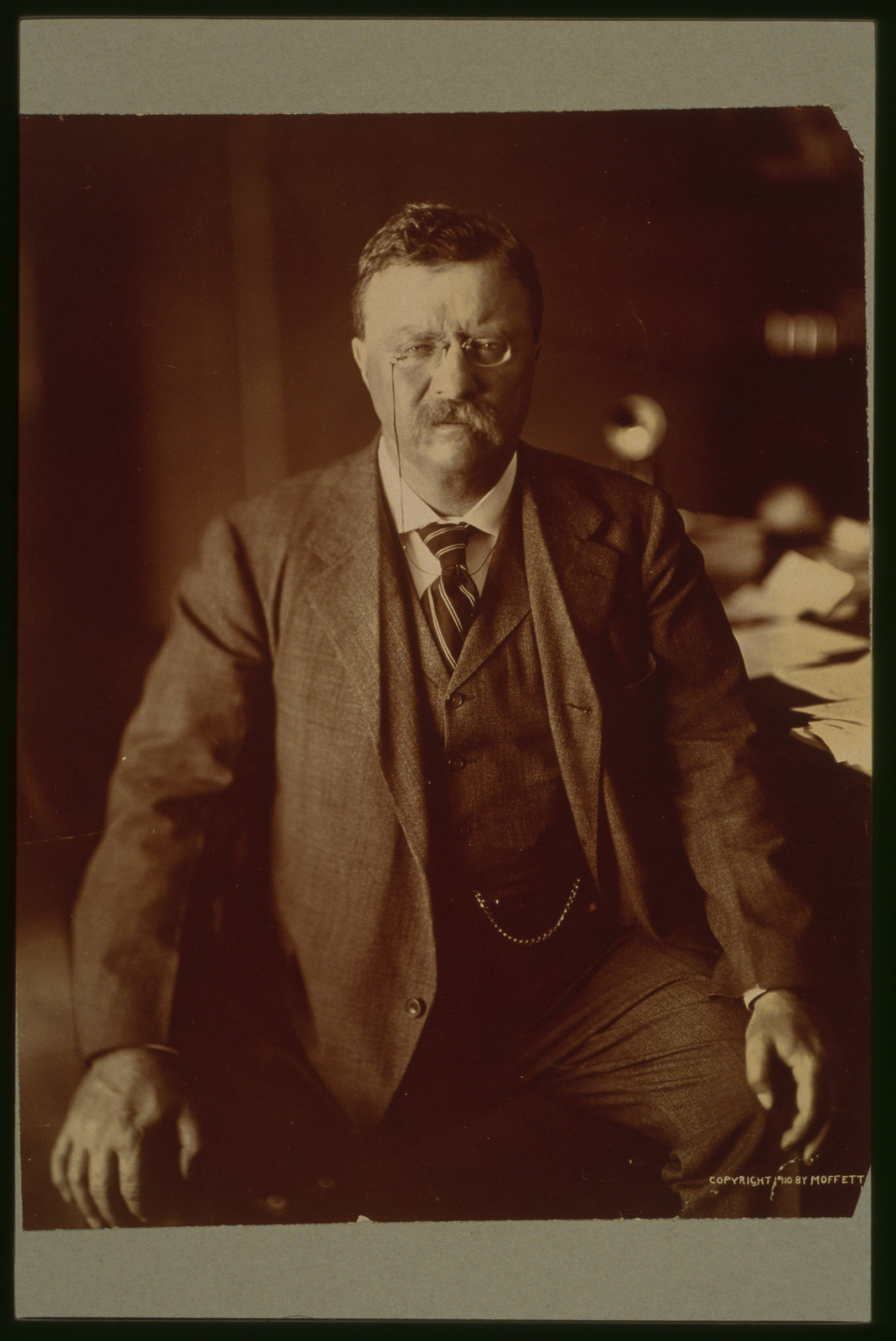 [Theodore Roosevelt, three-quarter length portrait, seated, facing front], c1910. — historic photograph