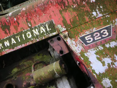 International 523 Diesel tractor badge on rusty red body