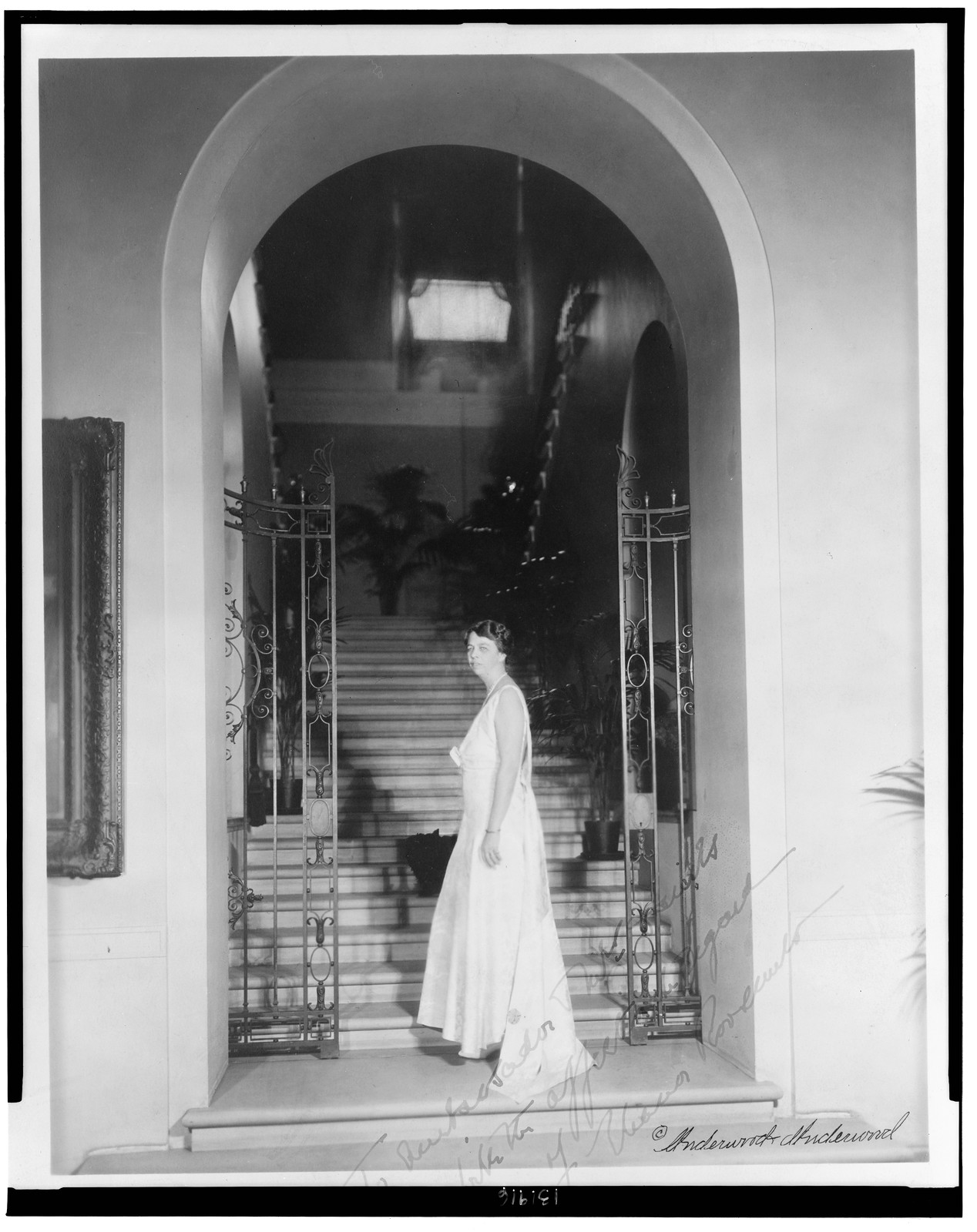 [Eleanor Roosevelt, full-length portrait, standing at bottom of staircase, facing left], [between 1932 and 1944] — historic photograph