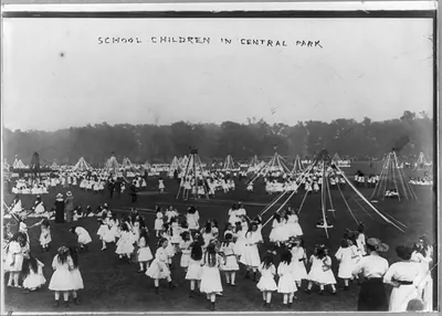 School children in Central Park, [New York City, with May poles]