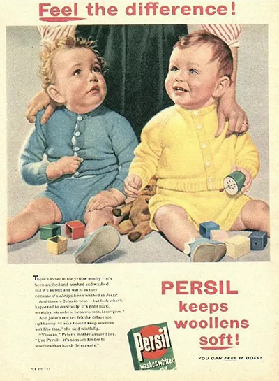 Persil advertisement: two babies in woolens, "Feel the difference