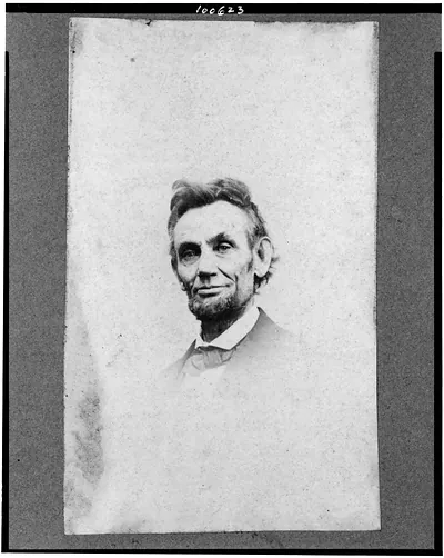 [Abraham Lincoln, head-and-shoulders portrait, facing slightly left; a detail from portrait showing Lincoln seated in a chair]