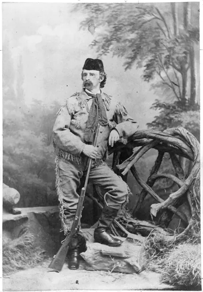 Gen. George Armstrong Custer, 1839-1876, full-length portrait, standing, facing left, wearing buckskin cloth and holding rifle