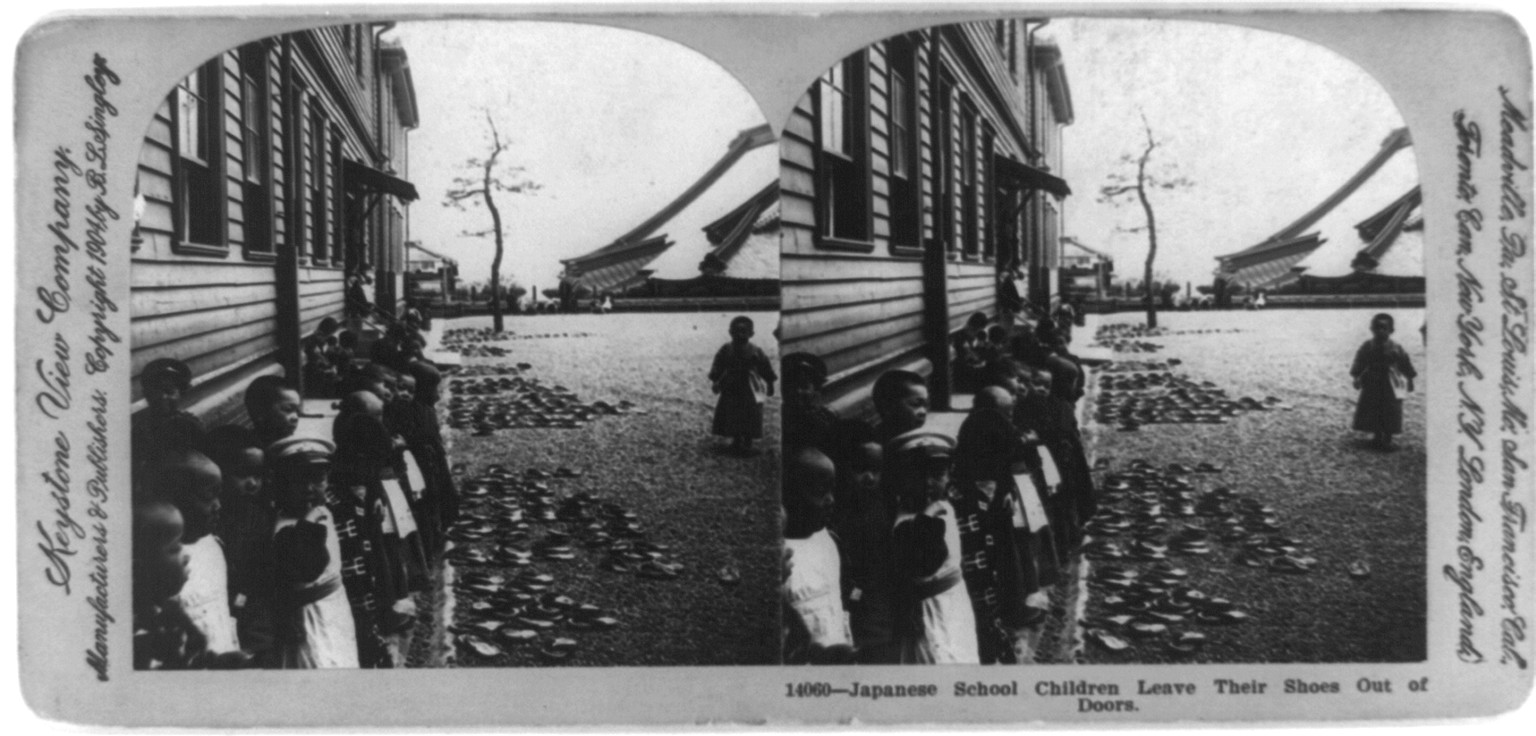 Japanese school children leave their shoes out of doors, c1904. — historic photograph