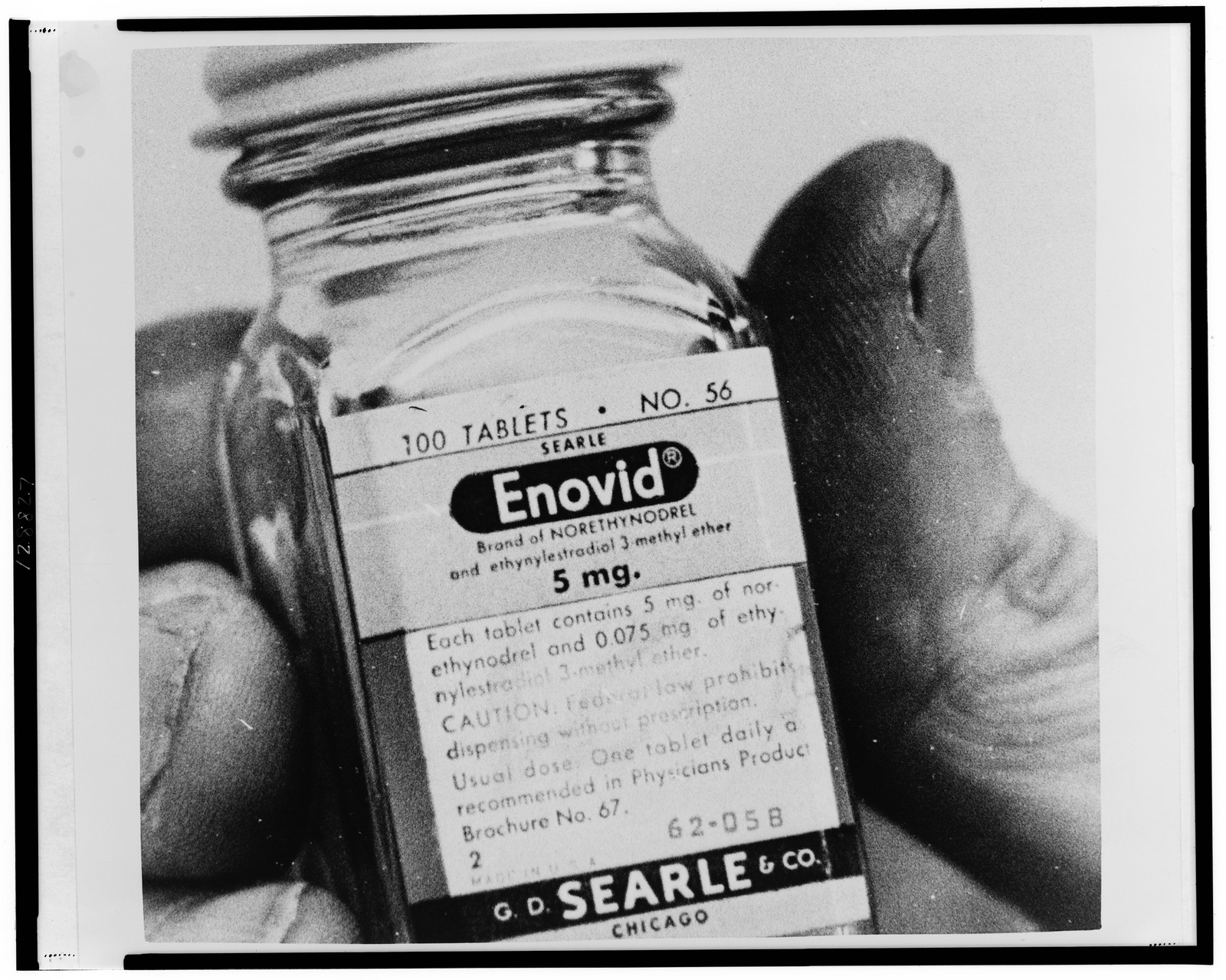 [Bottle containing oral contraceptive Enovid] — historic photograph