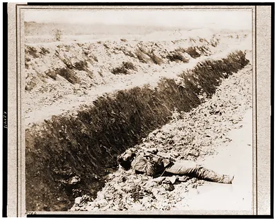 Dead Confederate soldier in trench at Fort Mahone Petersburg Va. April 3 1865