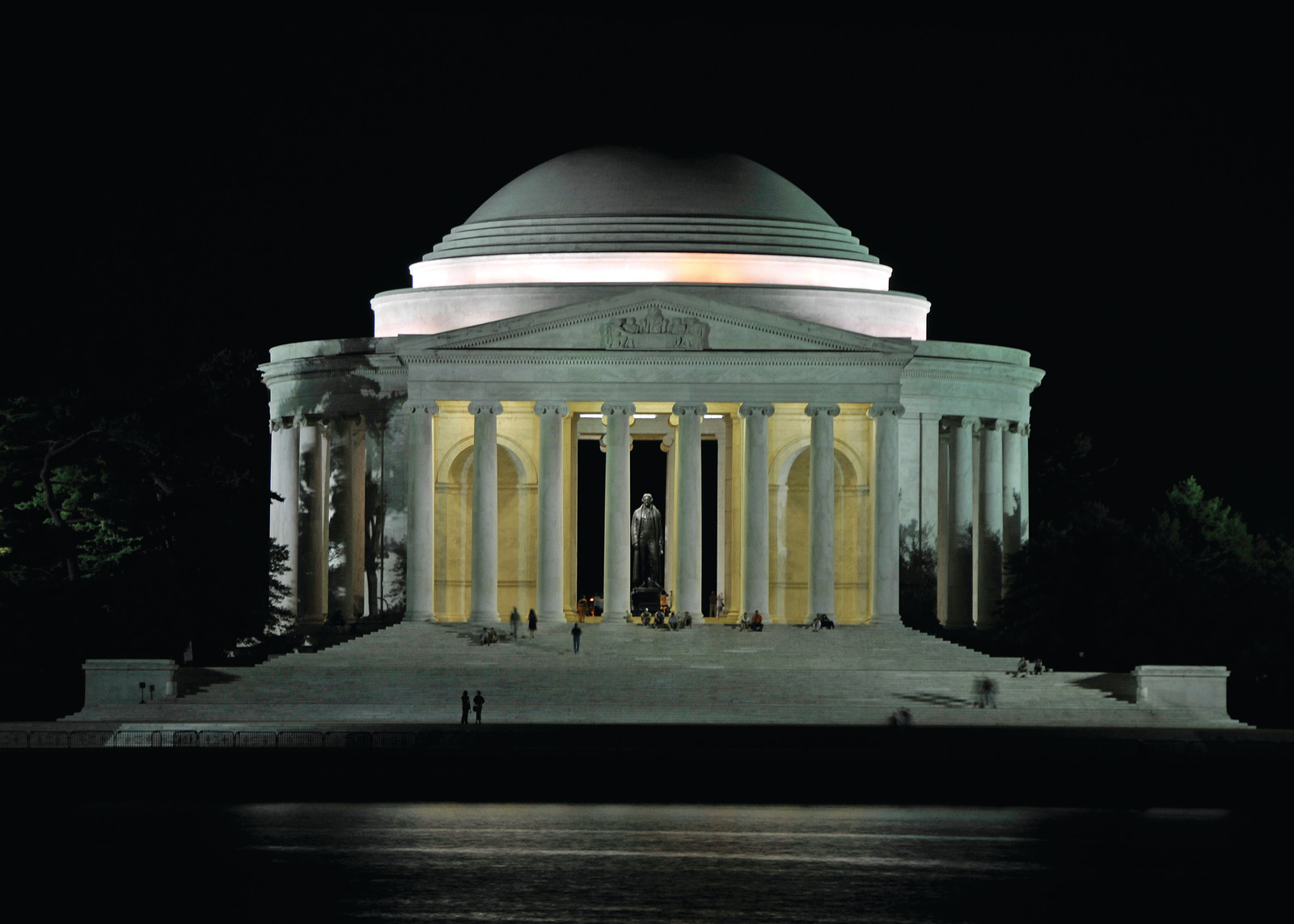 Jefferson Memorial at night, illuminated, viewed across water — historic image