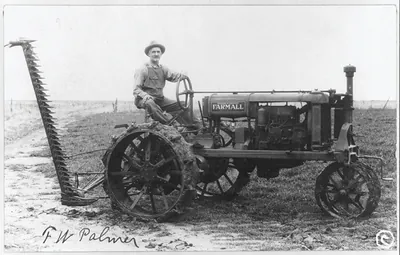 [Man operating a McCormick Deering Famrall tractor and reaper]