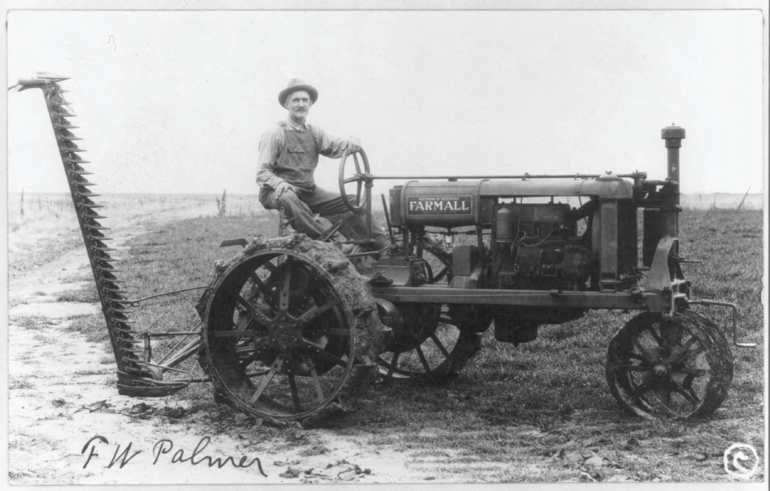 [Man operating a McCormick Deering Famrall tractor and reaper] — historic photograph