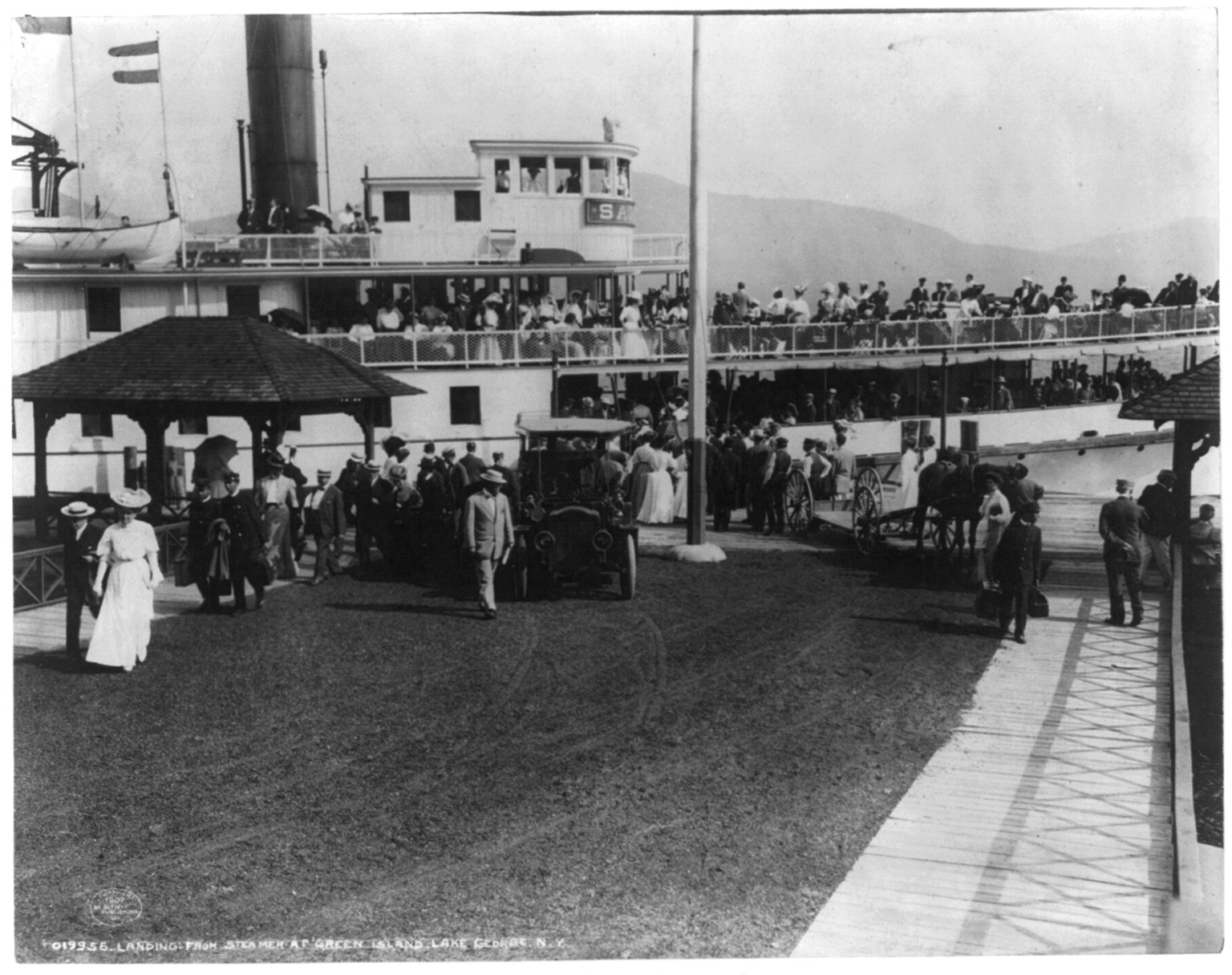 Landing from steamer at Green Island, Lake George, N.Y., c1907. — historic photograph