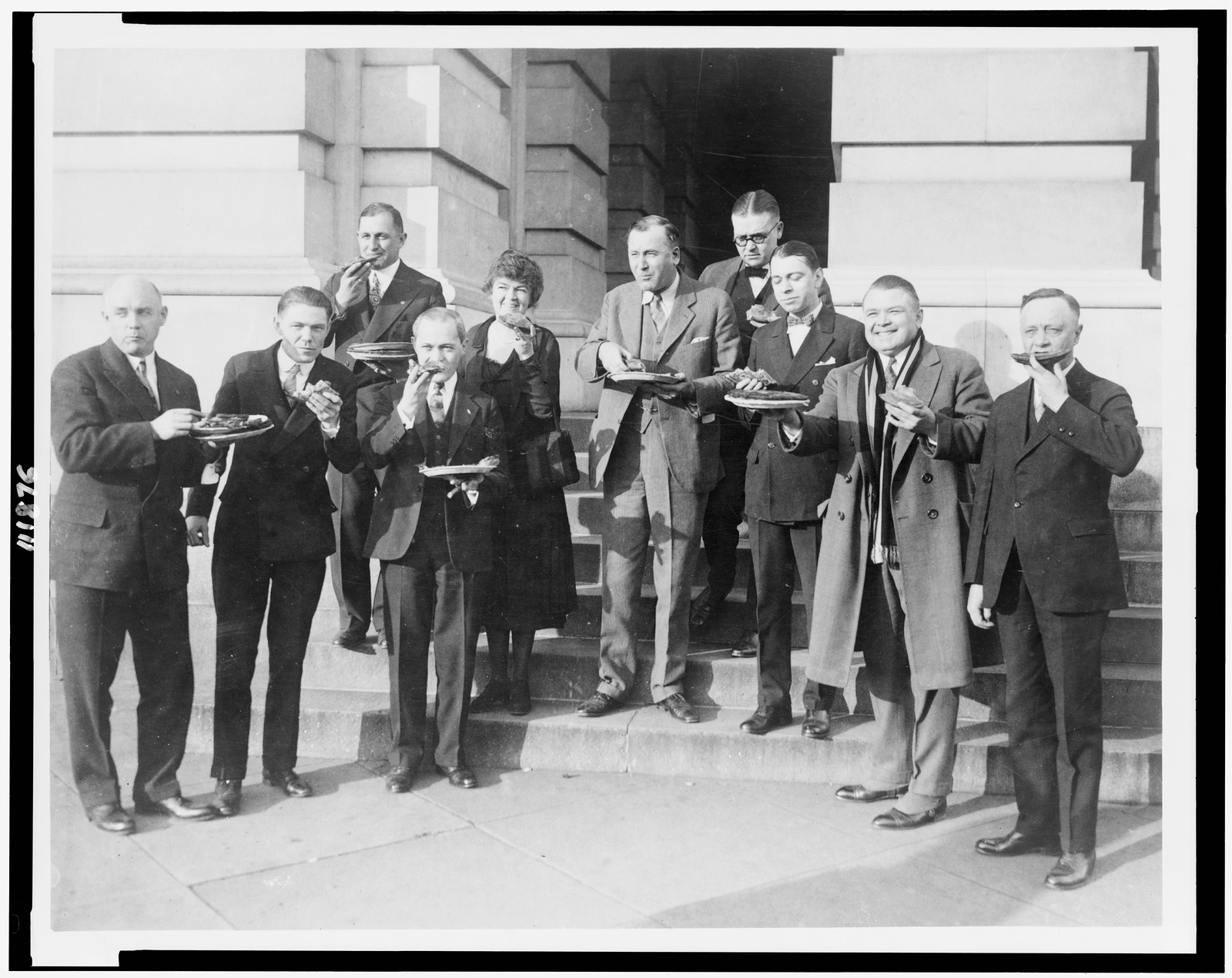 [Members of Congress posed, eating pie, left to right: Stewart Hoffman Appleby, Ralph Eugene Updike, William Radford Coyle, Samuel Dickstein, Edith Nourse Rogers, James Campbell(?) McLaughlin, Samuel James Montgomery, Clarence John McLeod, John Bartholomew Sosnowski, and Joseph Lawrence Hooper], [1926] — historic photograph