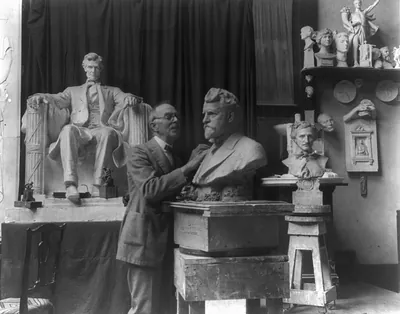 Daniel C. French in the Chesterwoord studio working on the bust of Ambrose Swasey