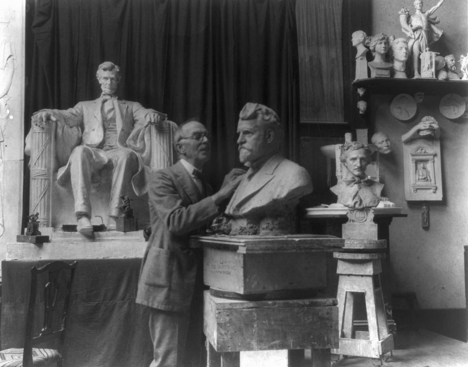 Daniel C. French in the Chesterwoord studio working on the bust of Ambrose Swasey — historic photograph