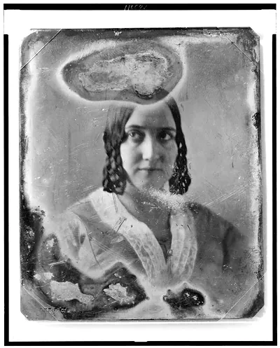 Daguerreotype portrait of a woman with curled hair and shawl