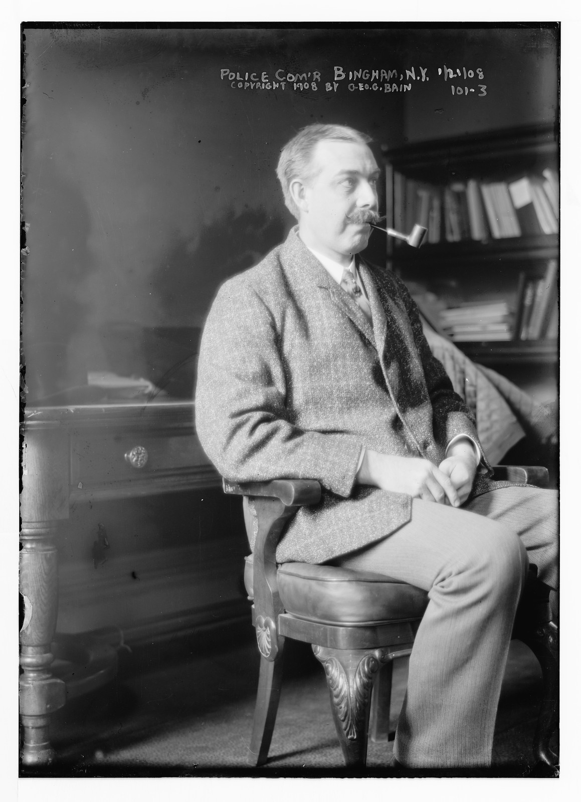 Police Commander Bingham, seated, with pipe, New York, 1/21/08. — historic photograph