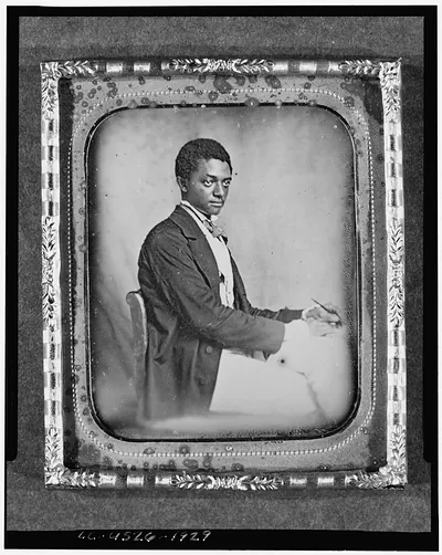 [James B. Yates, three-quarter length portrait, three-quarters view, seated in chair at desk]