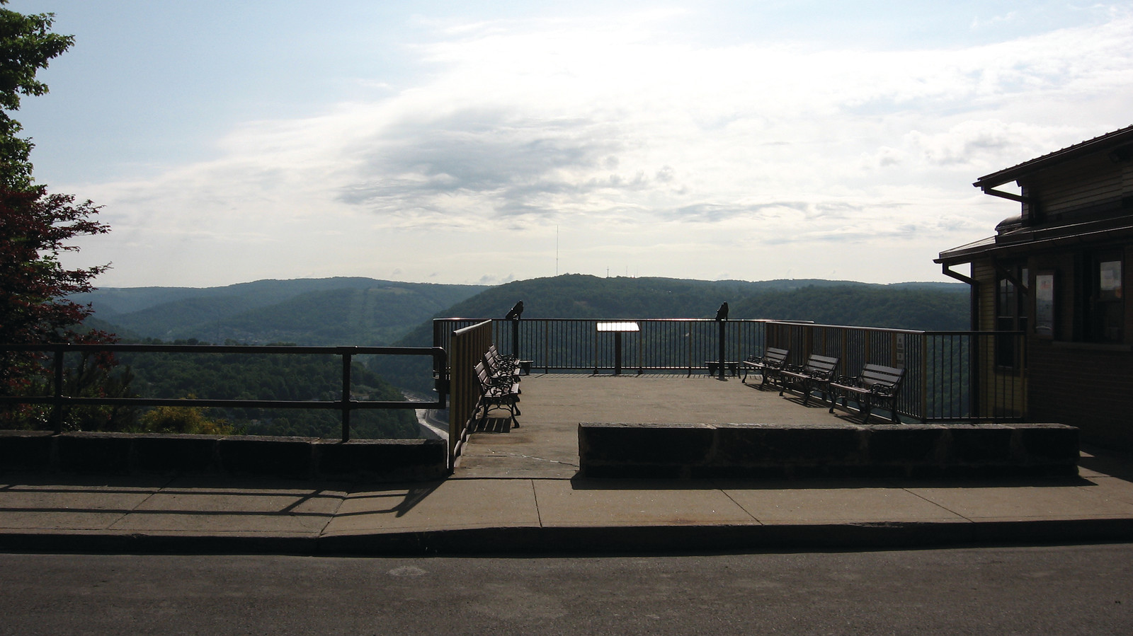 Overlook platform with benches above wooded hills — historic image