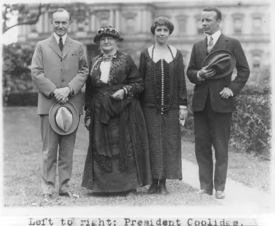 [President Coolidge, Mother" Jones Jr. posed standing on White House lawn.]"
