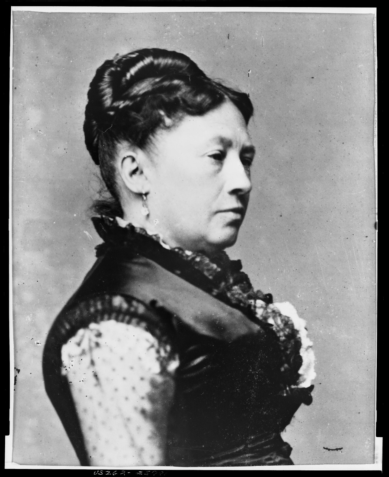 [Mrs. Ulysses S. Grant, full-length portrait, standing, facing right, between table and chair], [photographed between 1869 and 1877(?), printed later] — historic photograph